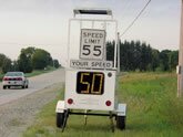 Speed of car on highway shown on trailer